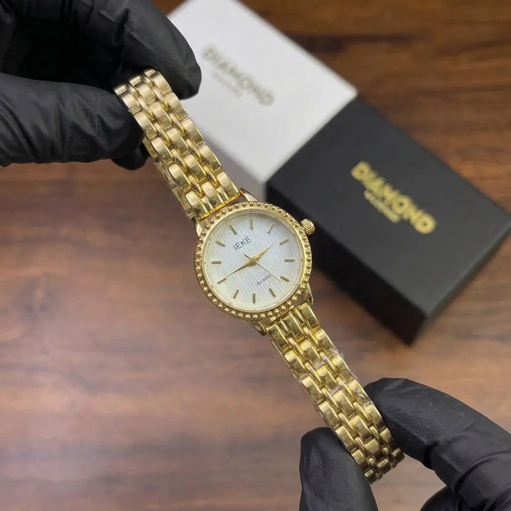 Elegant Gold Textured Dial Women's Watch image 1